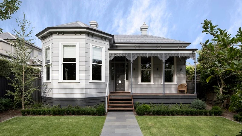 Grey and white double-fronted victorian with bay window