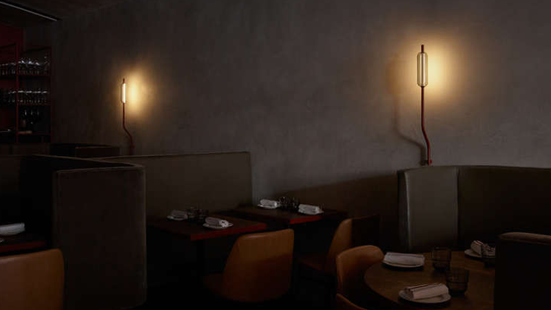interior dining setting dark with lamps and seating.