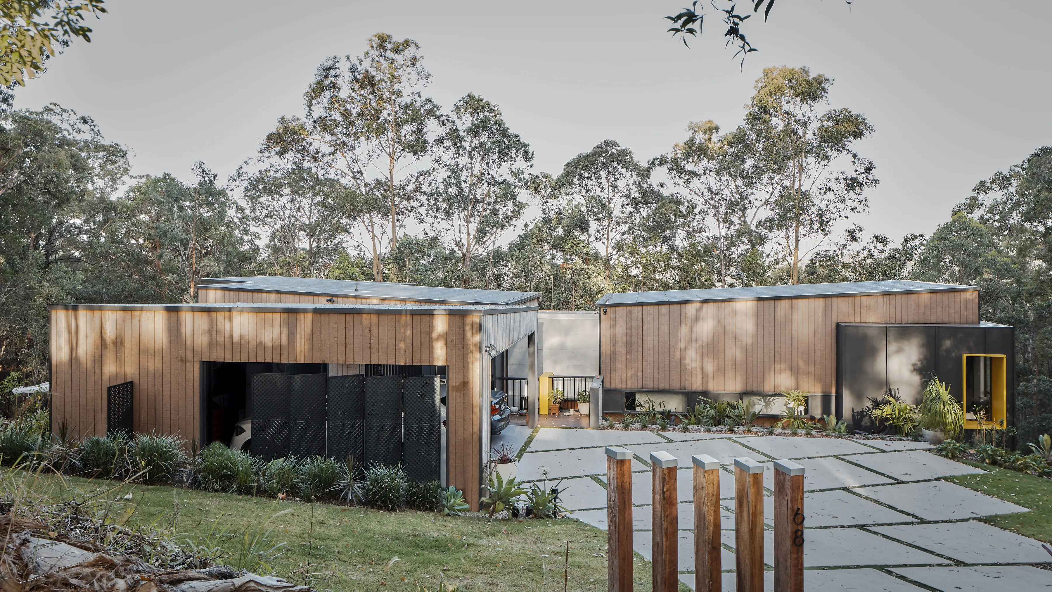 sectional timber house in bush setting