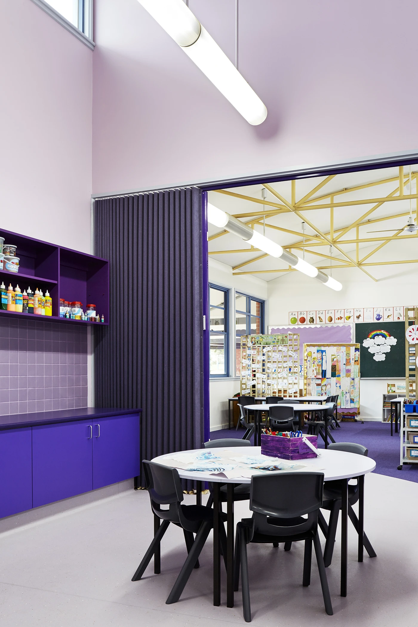Interior of classroom in three shades of purple.