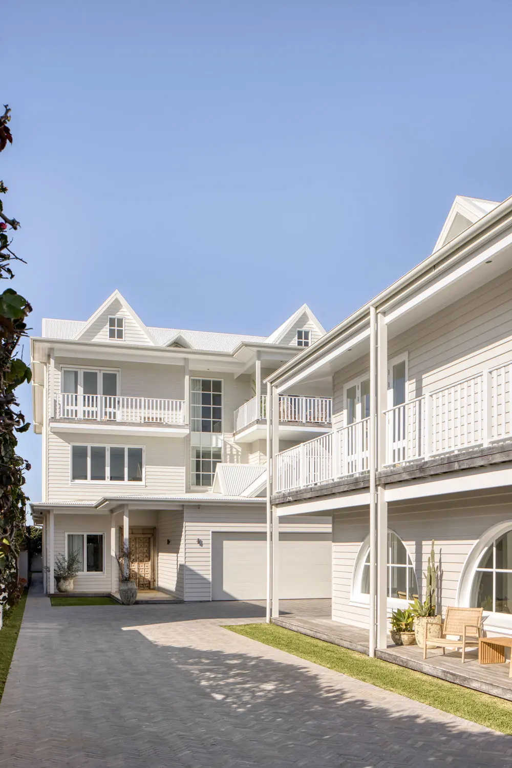 Exterior cream double storey weatherboard beach house