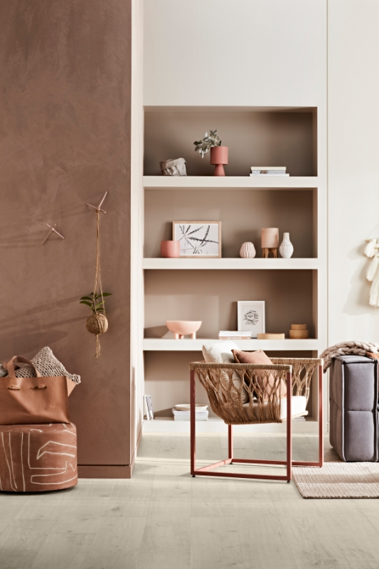 Living room with built-in bookcase in neutrals and browns.