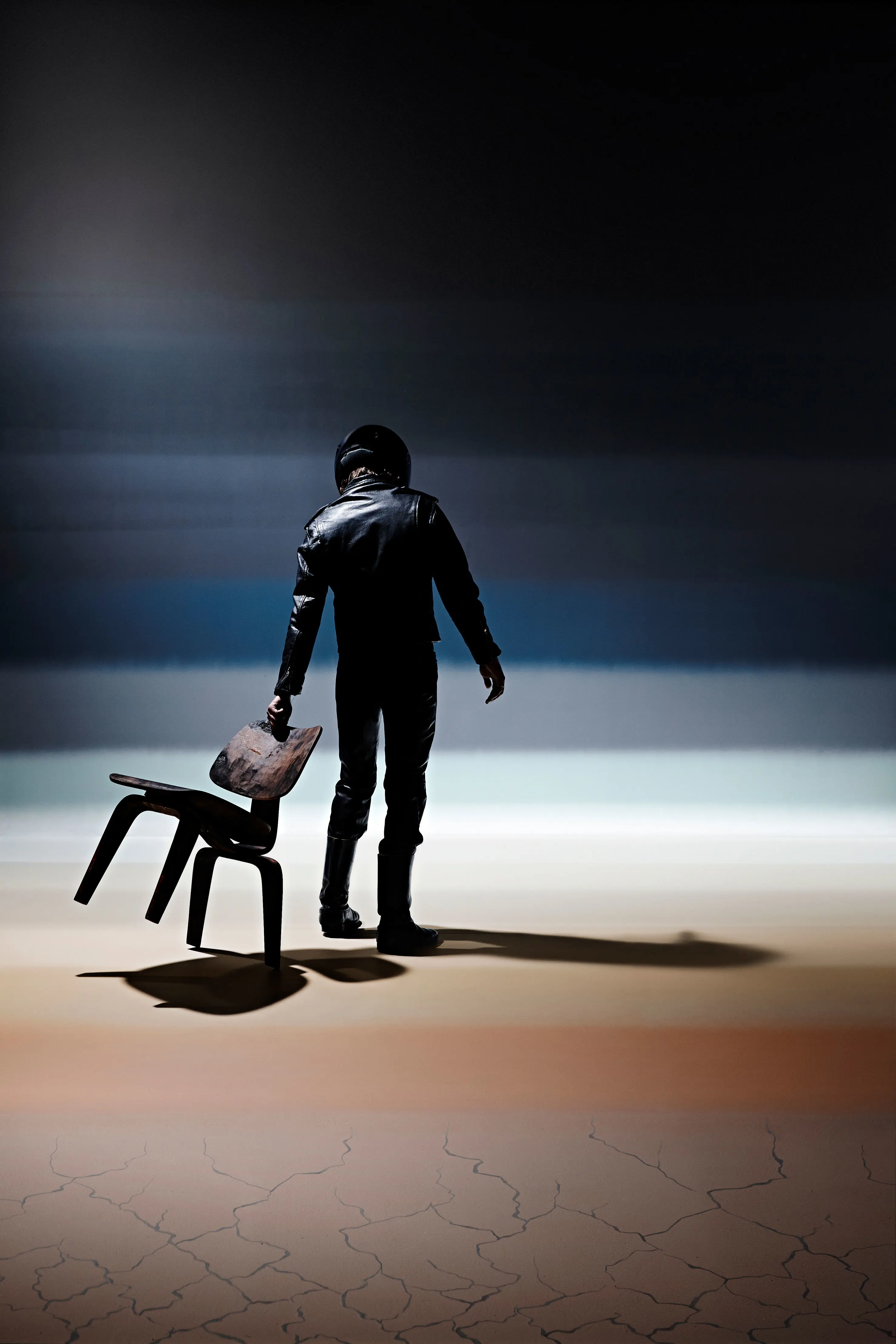 Man and chair with layered blue background