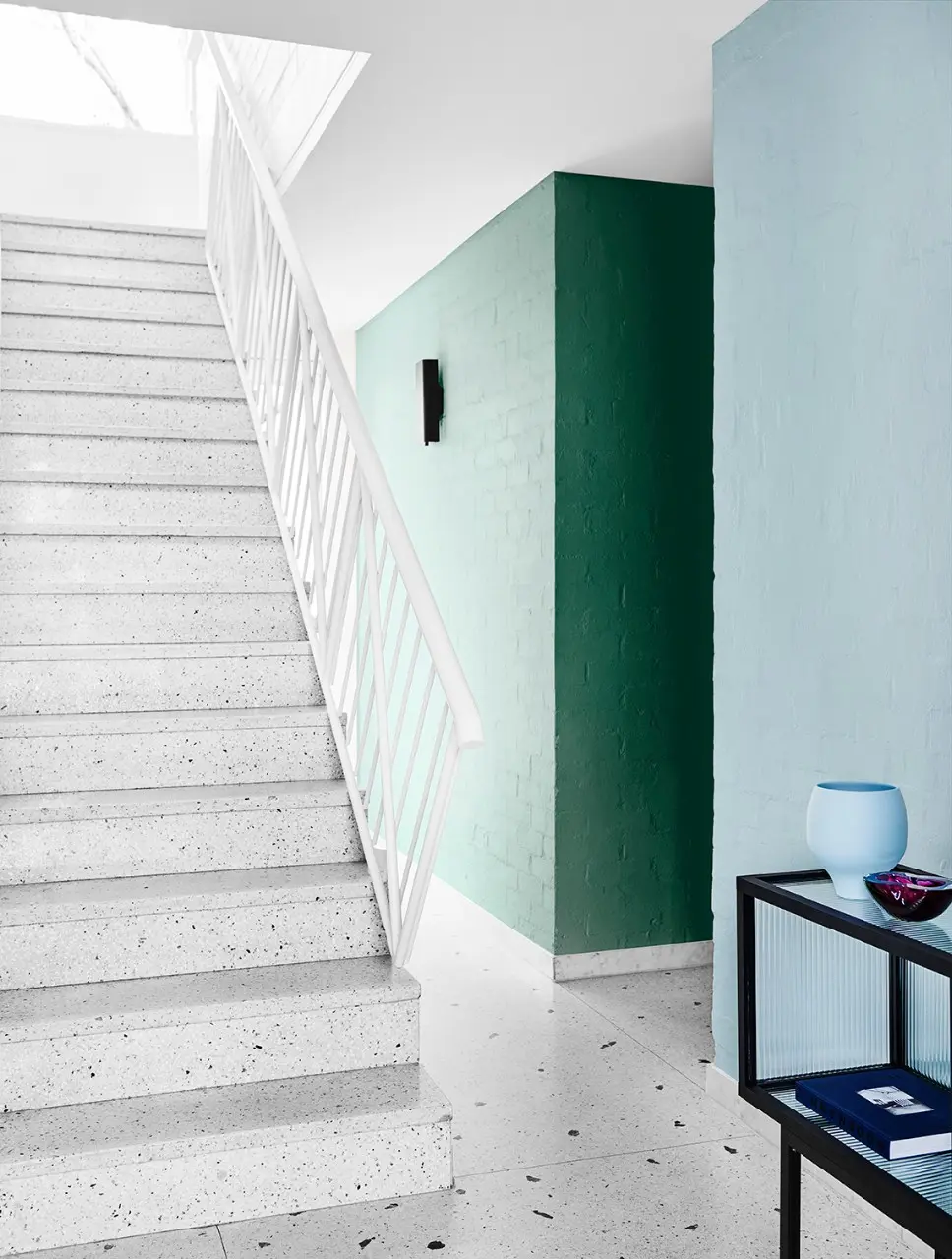 interior teal stairway and hallway. 