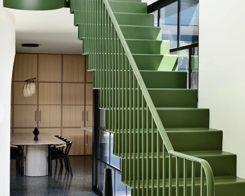 Green staircase in dining room
