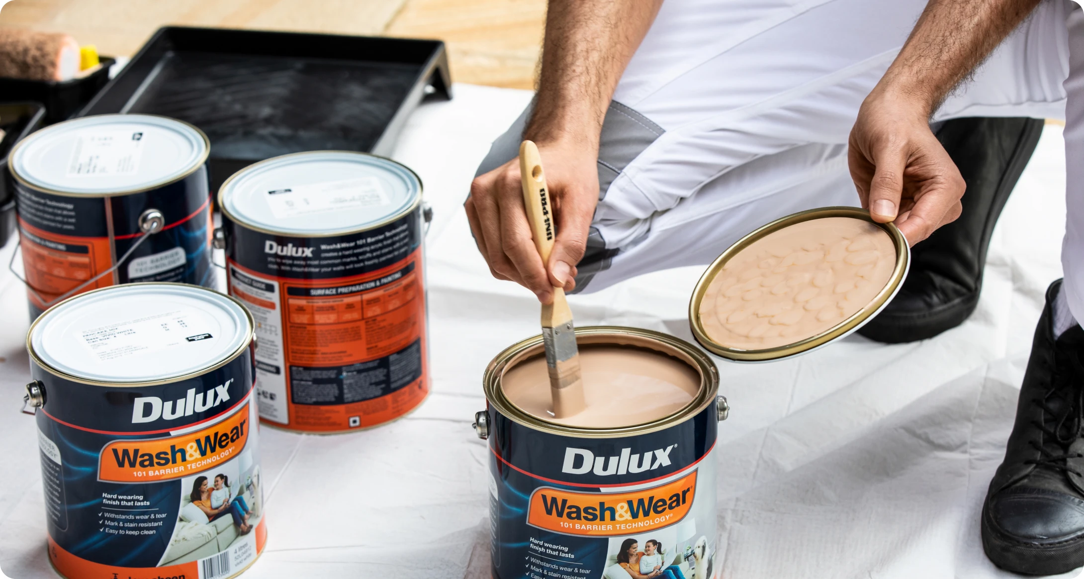 Dulux wash and wear paint can on white sheet
