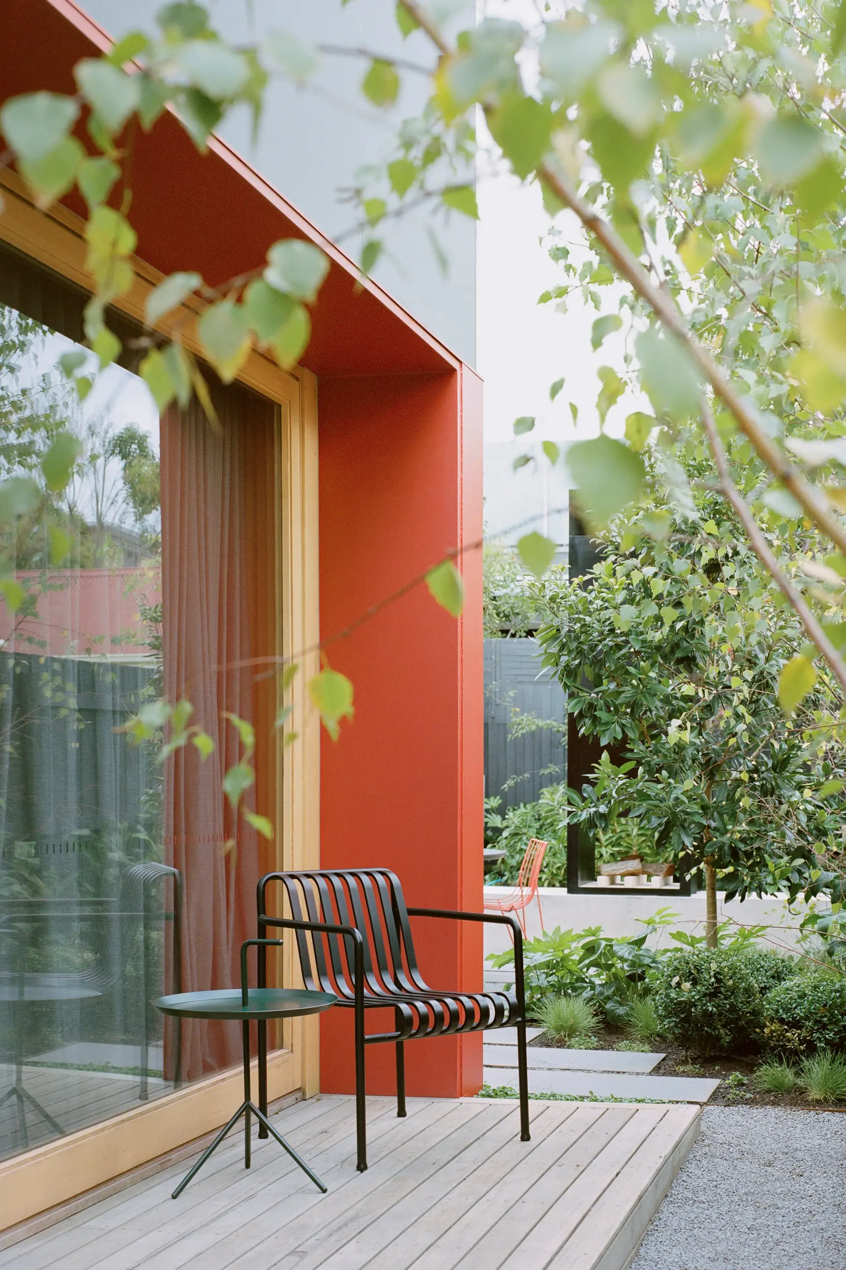 Black chair and table on wooden deck 