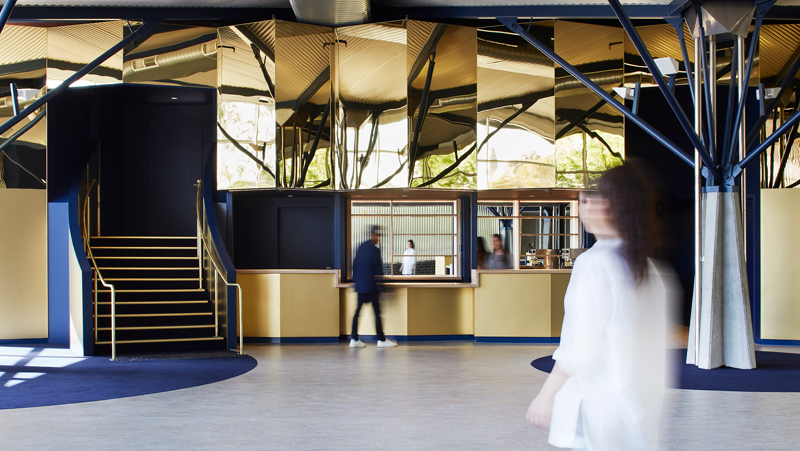 interior yellow, blue and mirror stairway entrance.