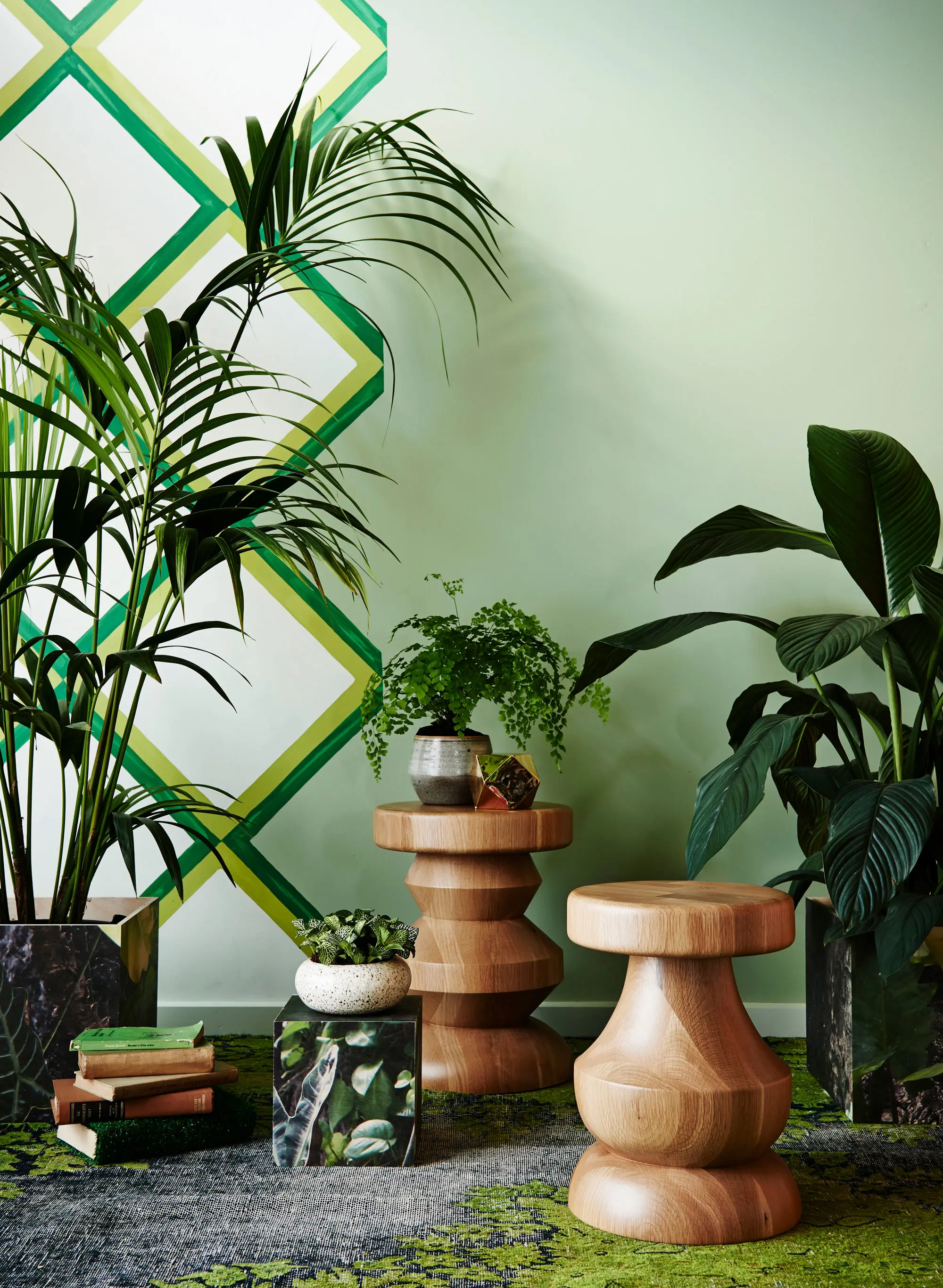 Green room with small timber tables and plants