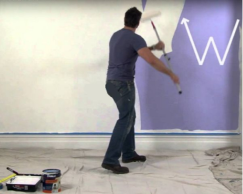 Man painting wall with roller using a W motion