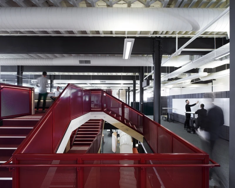Interior office with red metal railing