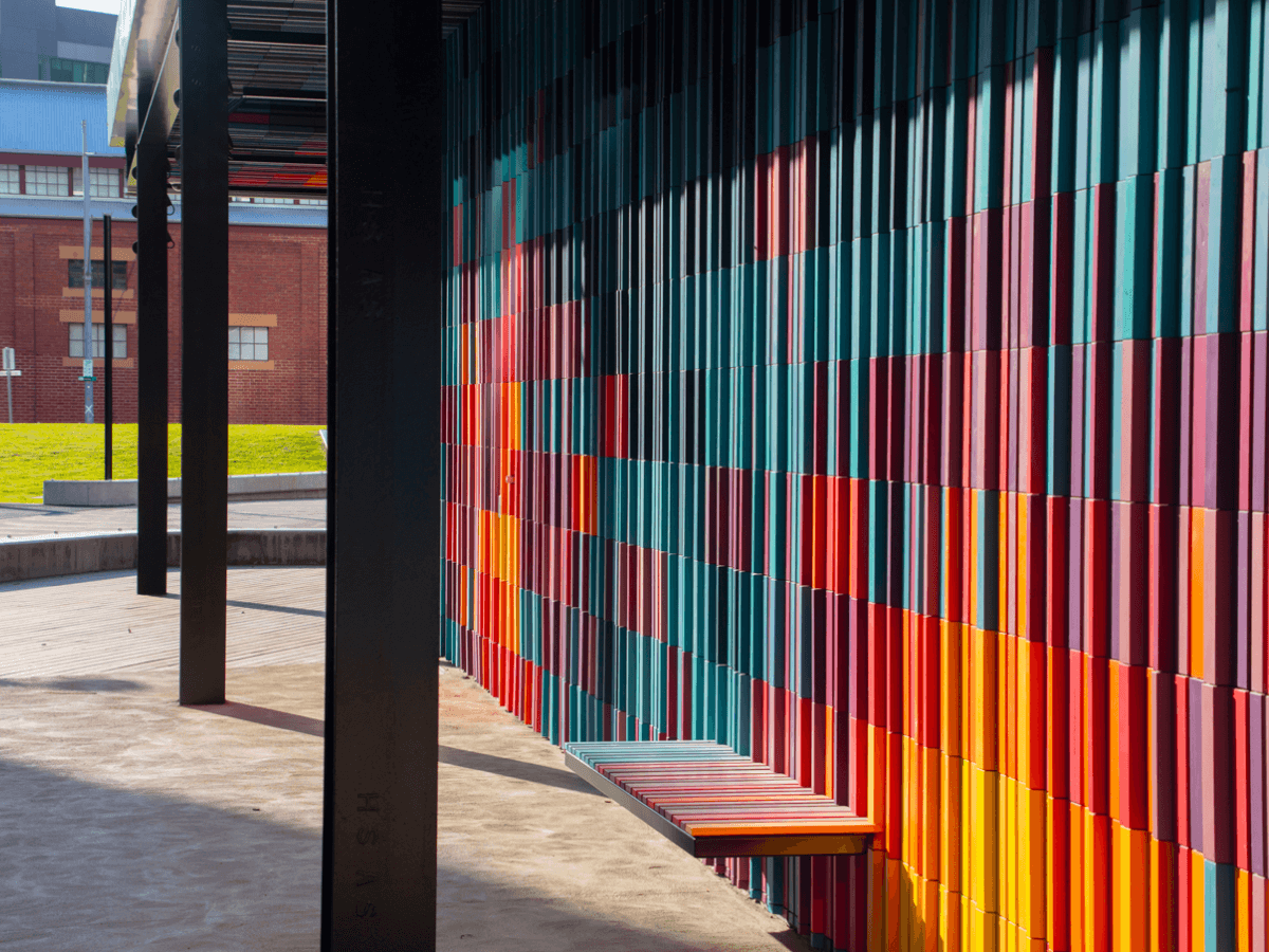 Colourful commercial building with bench seat