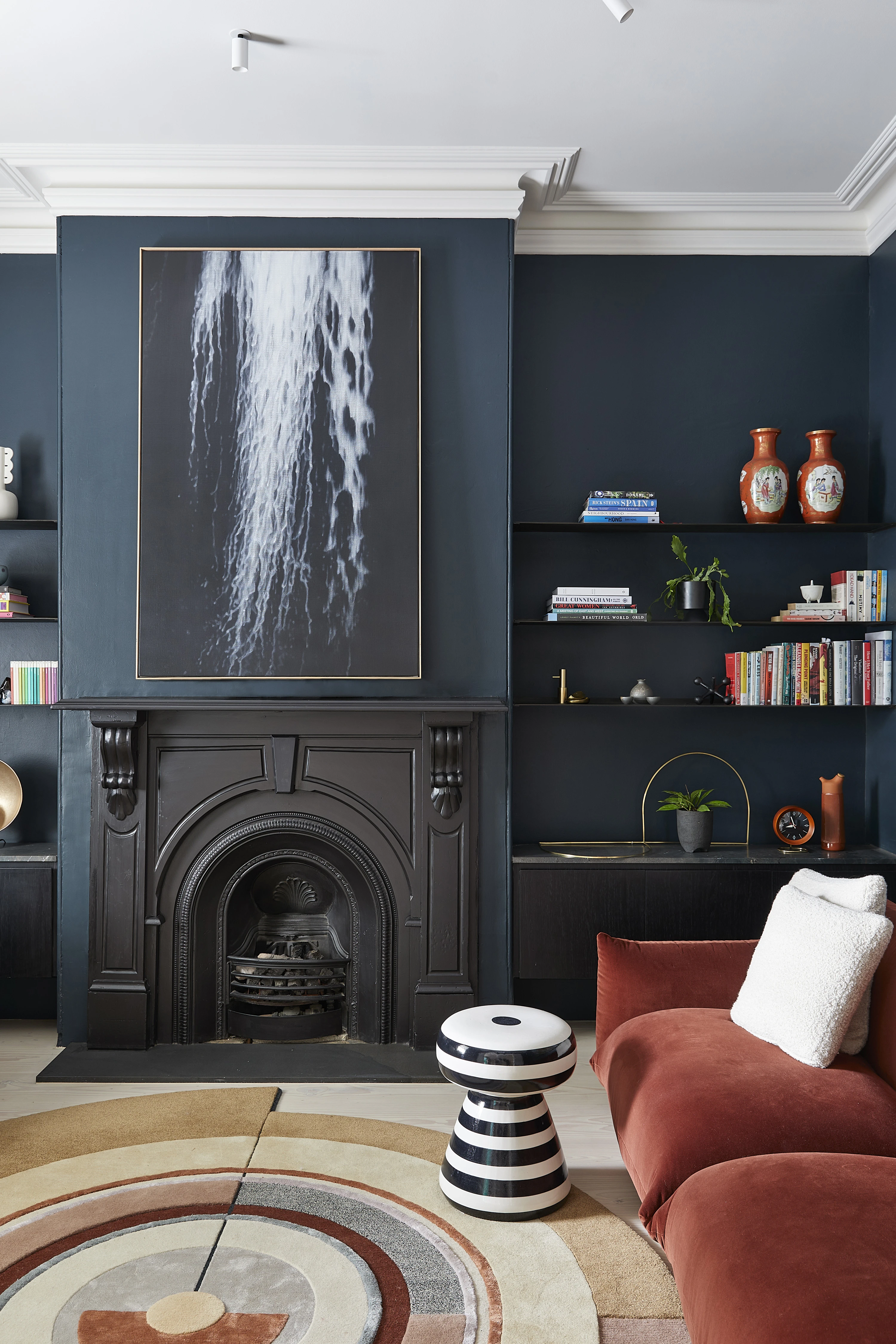 Living room with black fireplace and mantle