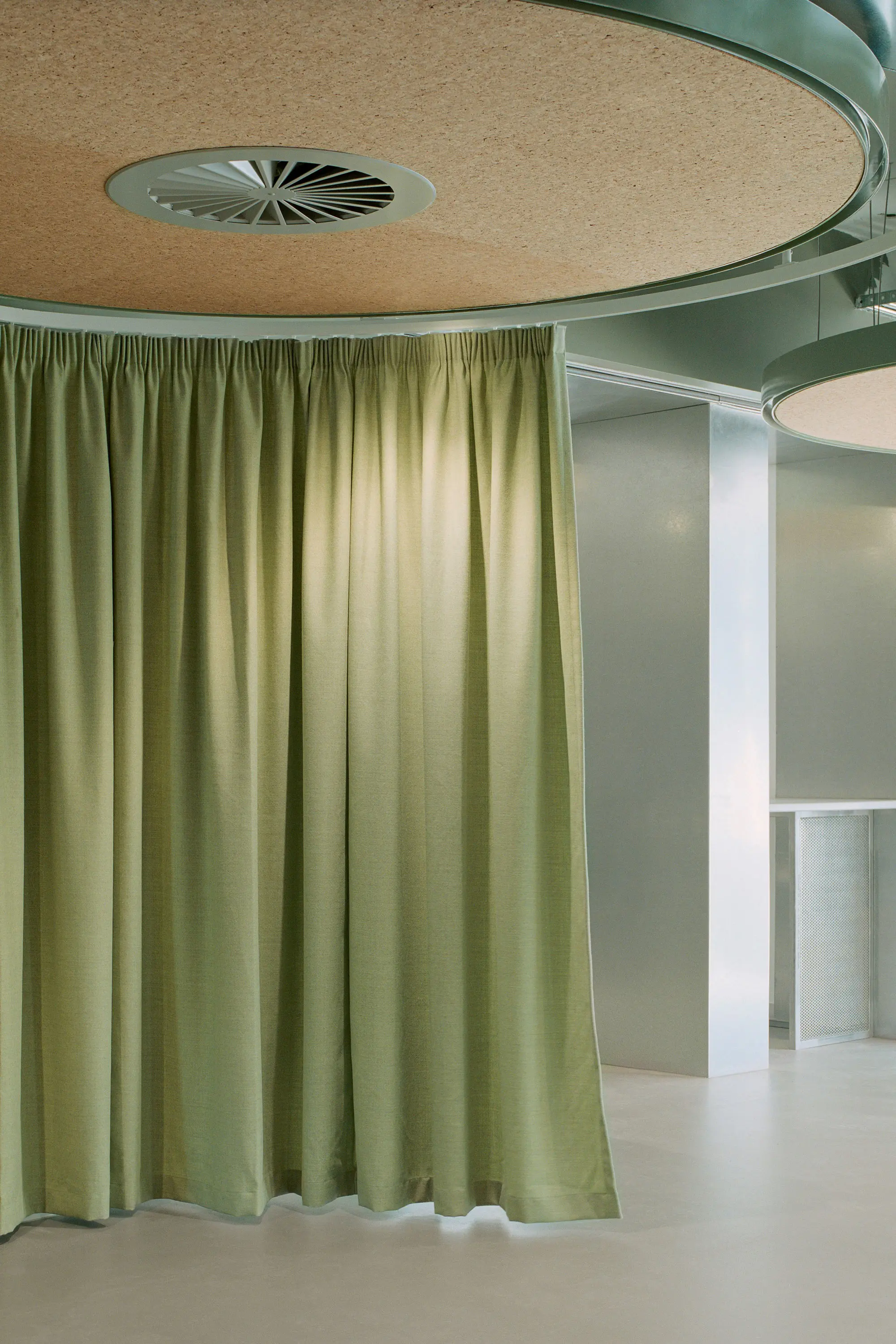 Green office with floor to ceiling curtains