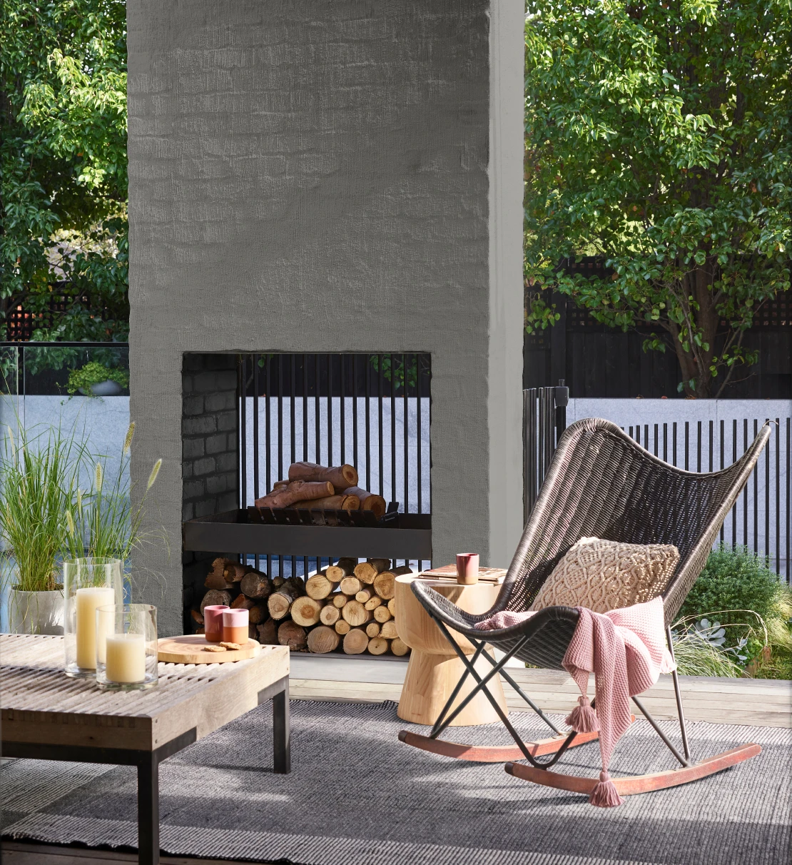 Exterior entertaining area with a Pewter Frame coloured fireplace and seating area.