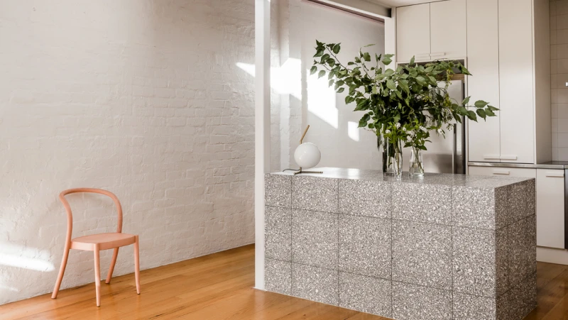 White kitchen with grey tiled bench