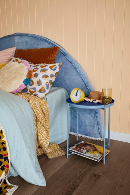 Apricot bedroom with blue side table