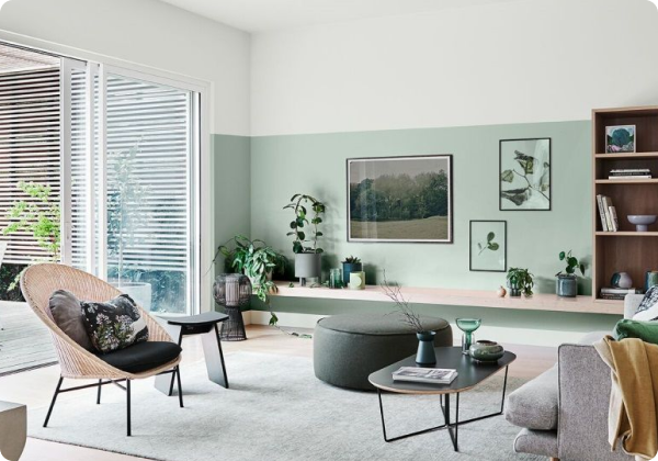Green and neutral two-tone living room with post-modern furniture