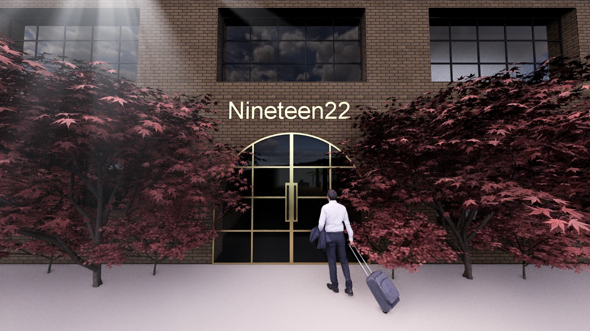 Graphically designed exterior of Nineteen22 with two large dark red trees to side of brick facade.