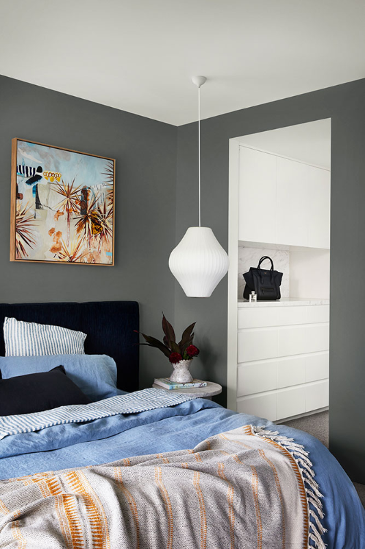 interior grey bedroom with walk in wardrobe. 