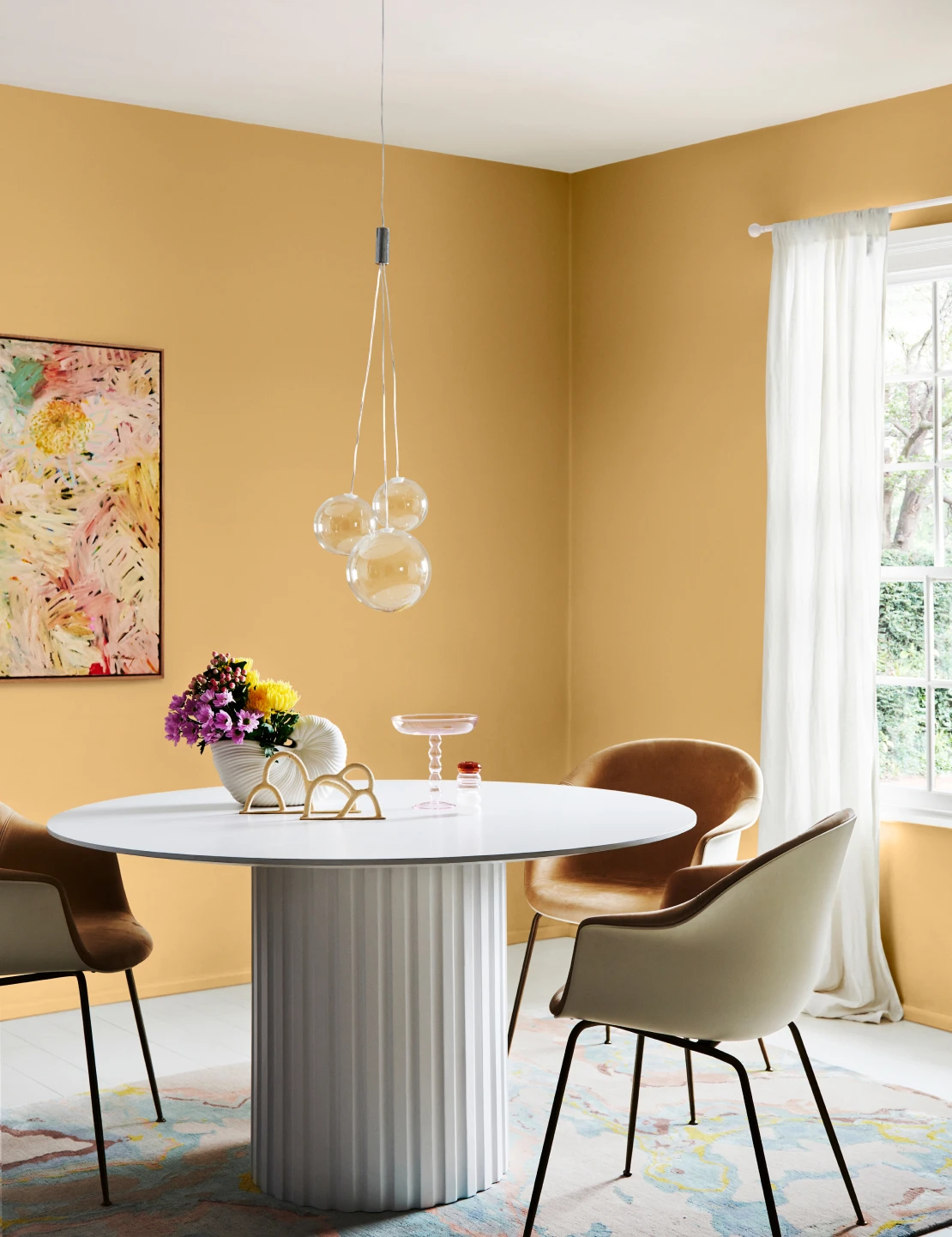 Interior dining room with Sandpaper coloured walls, dining table and 3 chairs