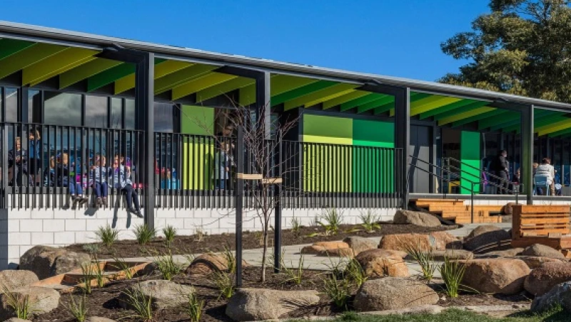 Two-tone green single storey school building 