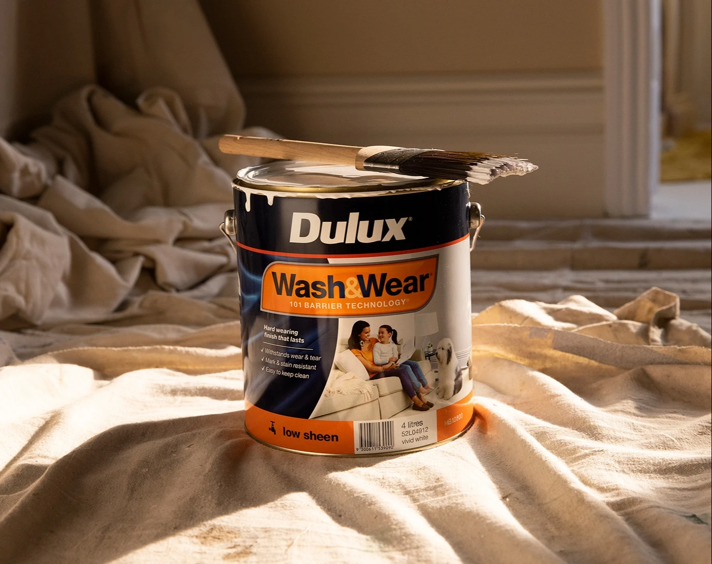 Can of Dulux Wash&Wear on drop sheet