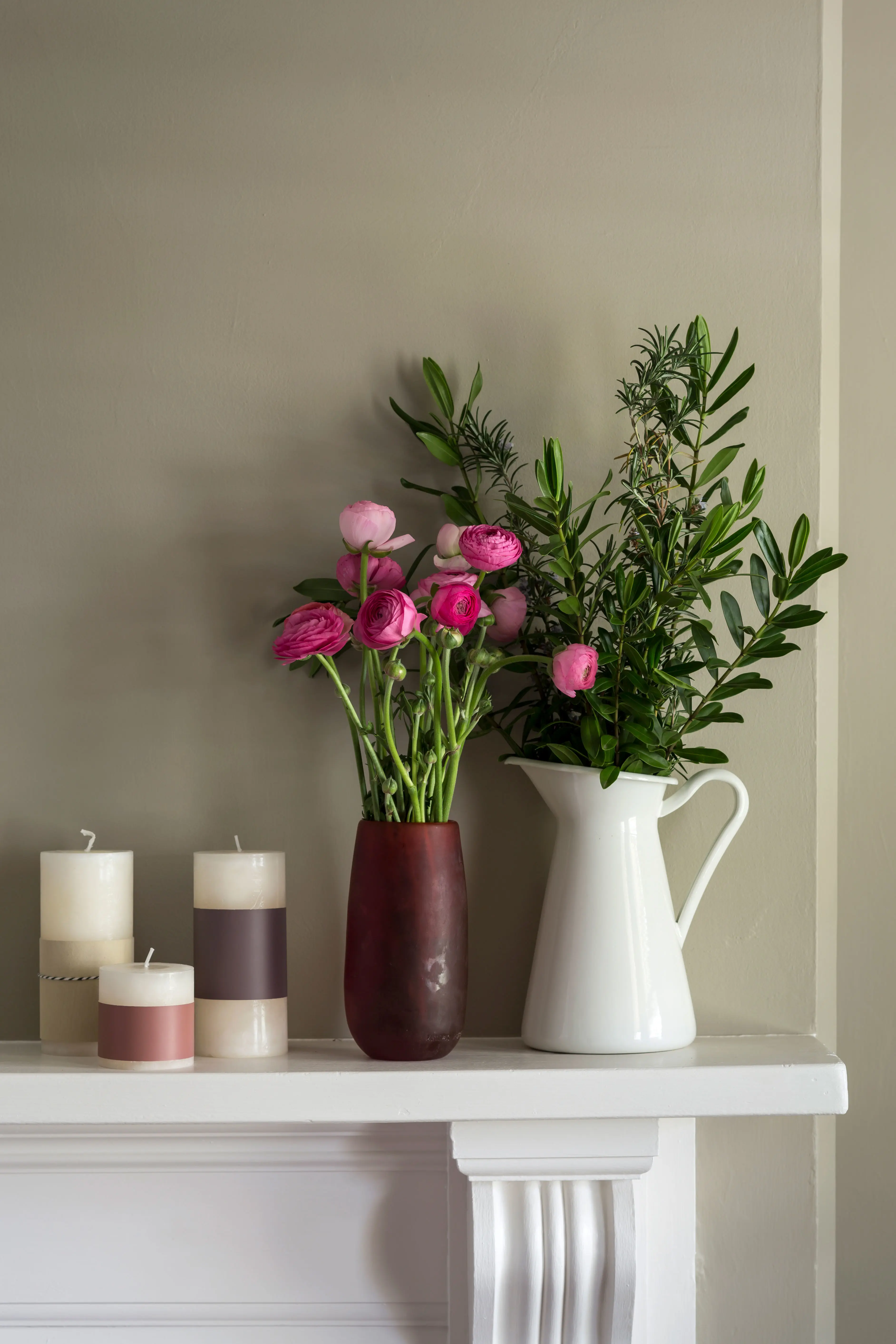 White mantle with pink flowers in vase, white jug and three candles: Colour Forecast 2013 - Merge palette 