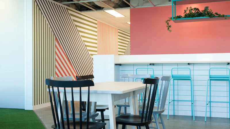 Eating area with multicoloured striped wall