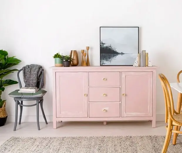 view of pink drawers in front of white wall 