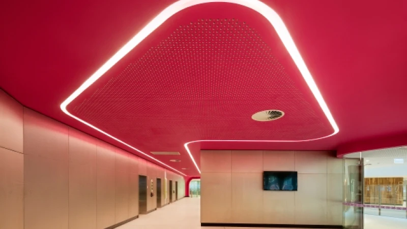 Cancer centre with pink ceiling and curved inset lighting