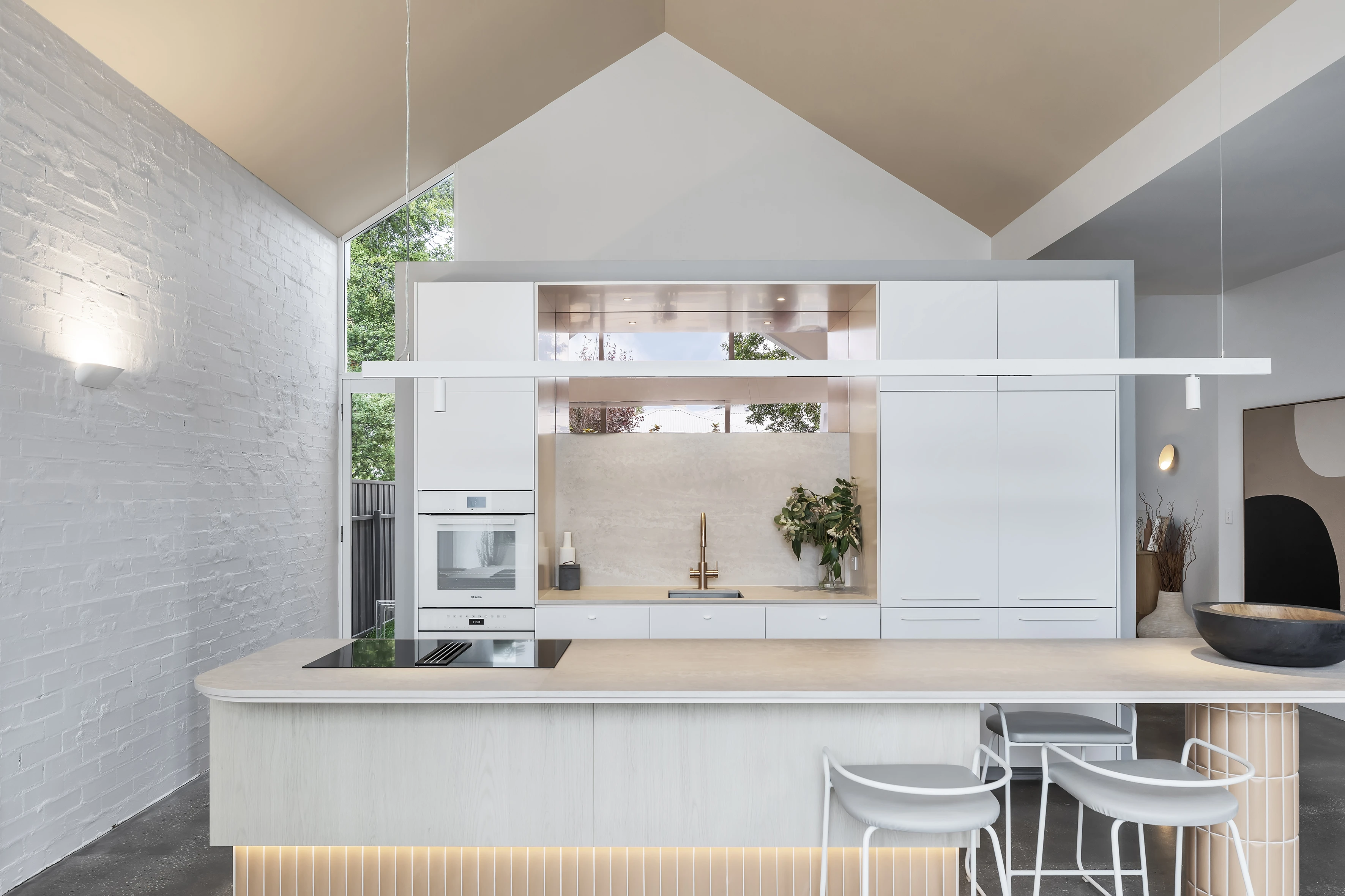 White kitchen with pitched cream ceiling