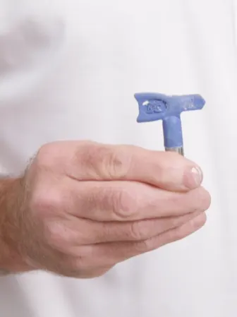 Hand holding spray tip