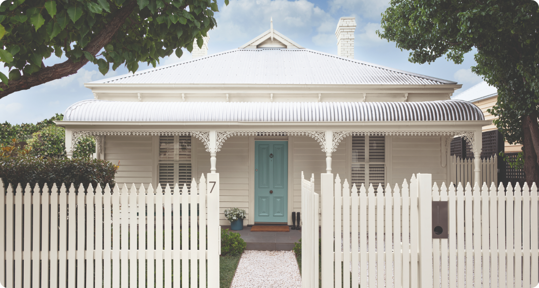 White double-fronted Victorian weatherboard with blue-green door