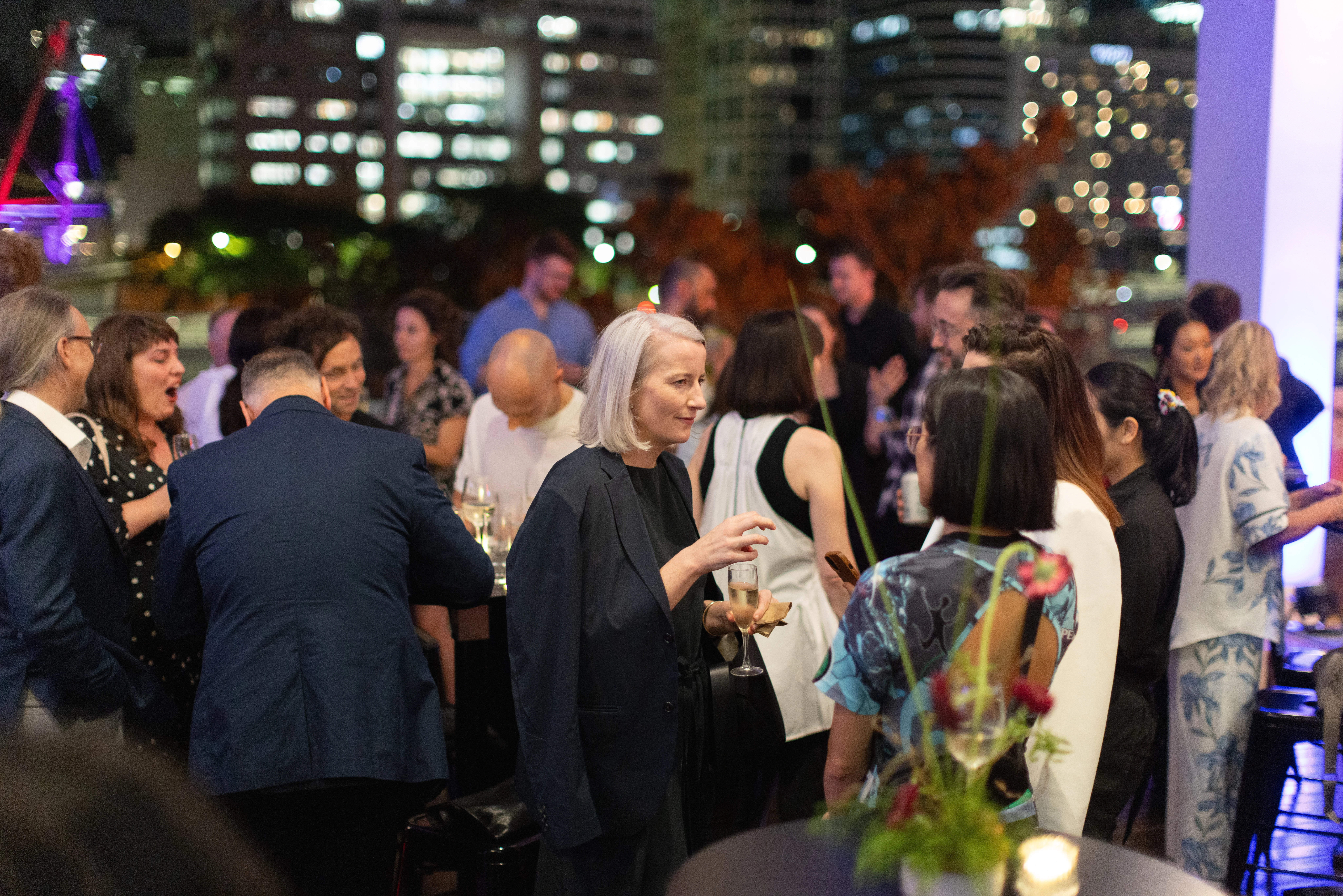 Architects and design professionals celebrating the 2025 Dulux Study Tour alumni at QAGOMA
