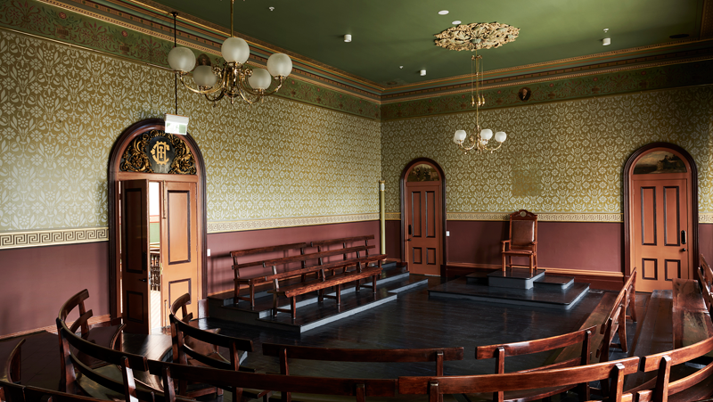 interior old council chamber. Red woods, greens and golds.