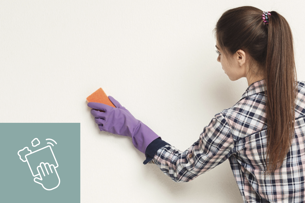 Woman sanding white wall with inset of sanding icon