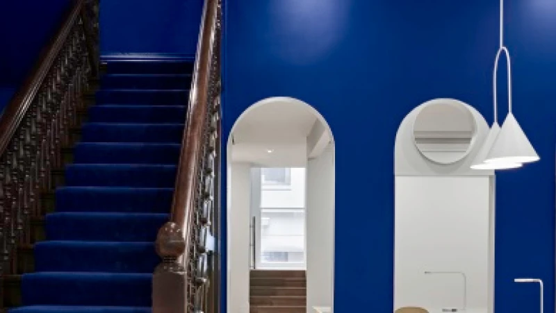 Blue office and traditional staircase