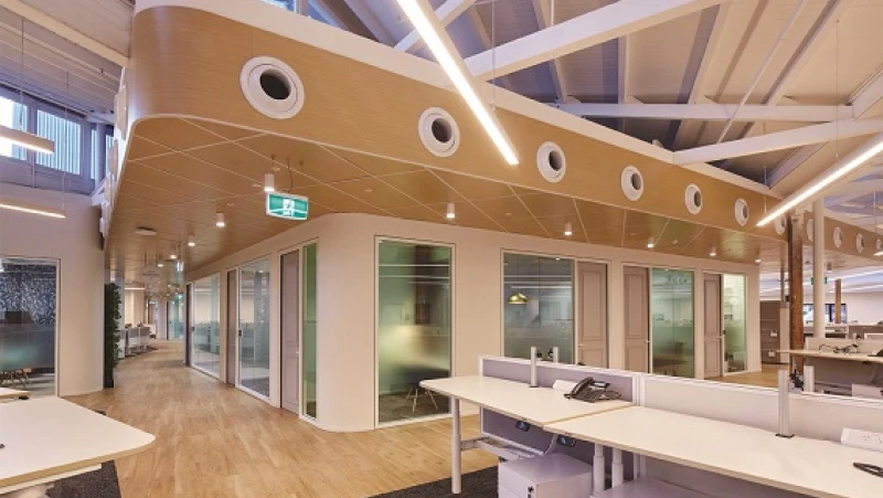 White and timber open plan office with enclosed offices in the centre