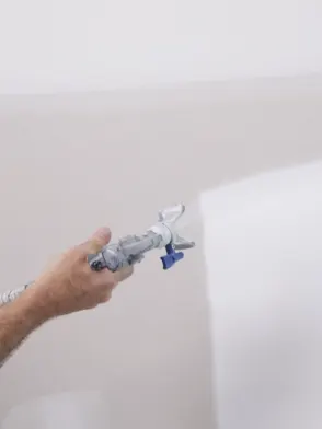 Man using paint sprayer
