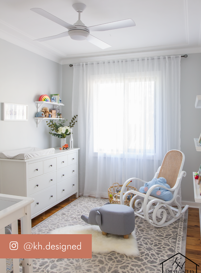 White and grey nursery with rocking chair and chest of drawers