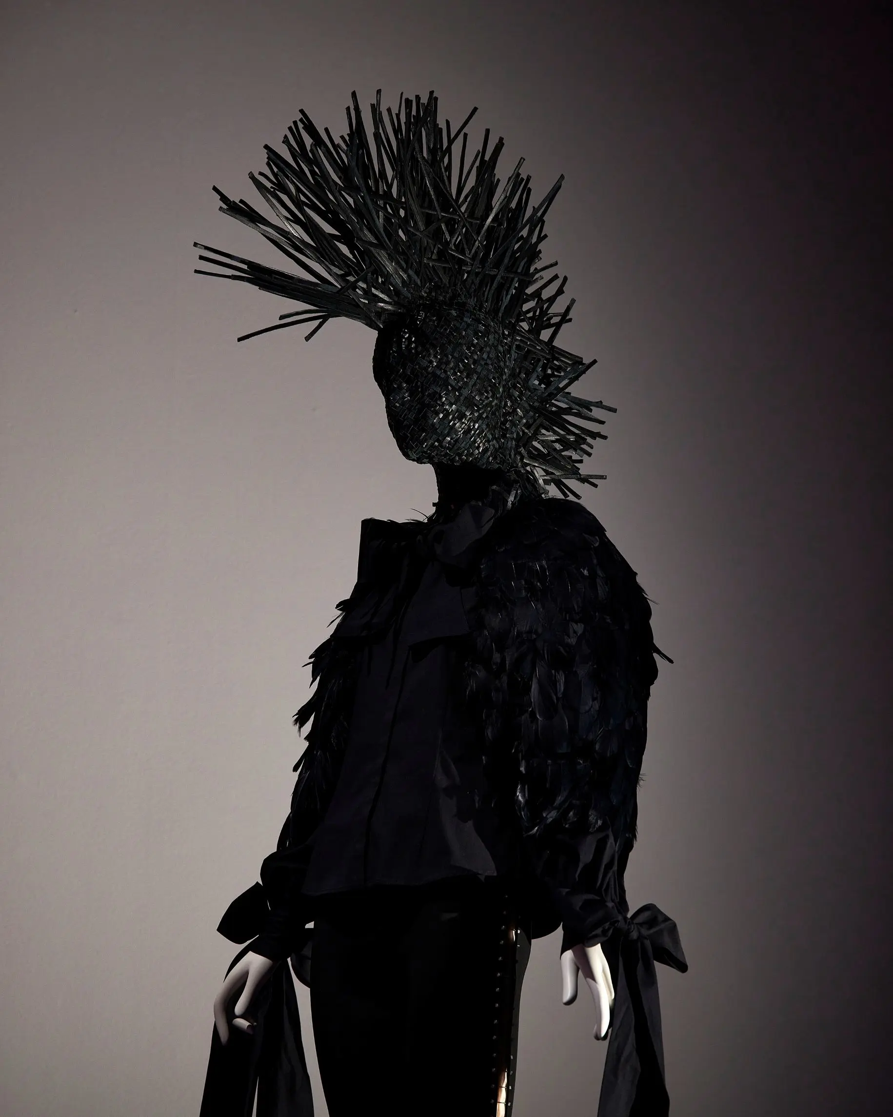 NGV Alexander McQueen mohawk silhouette against grey wall