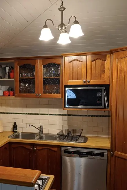 Kitchen with timber cabinetry. 