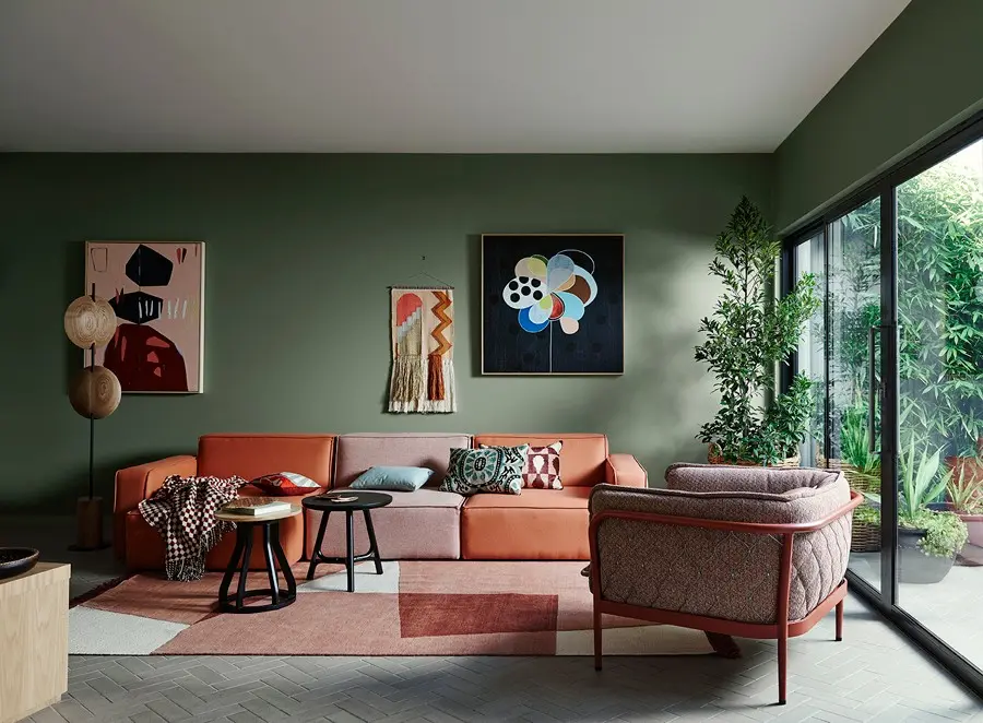 interior lounge in green with orange and red details.