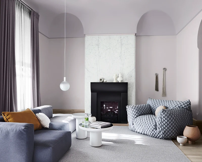 interior lounge grey couch and chair with fireplace.