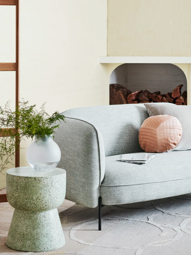 Bedroom with a grey wall and fireplace