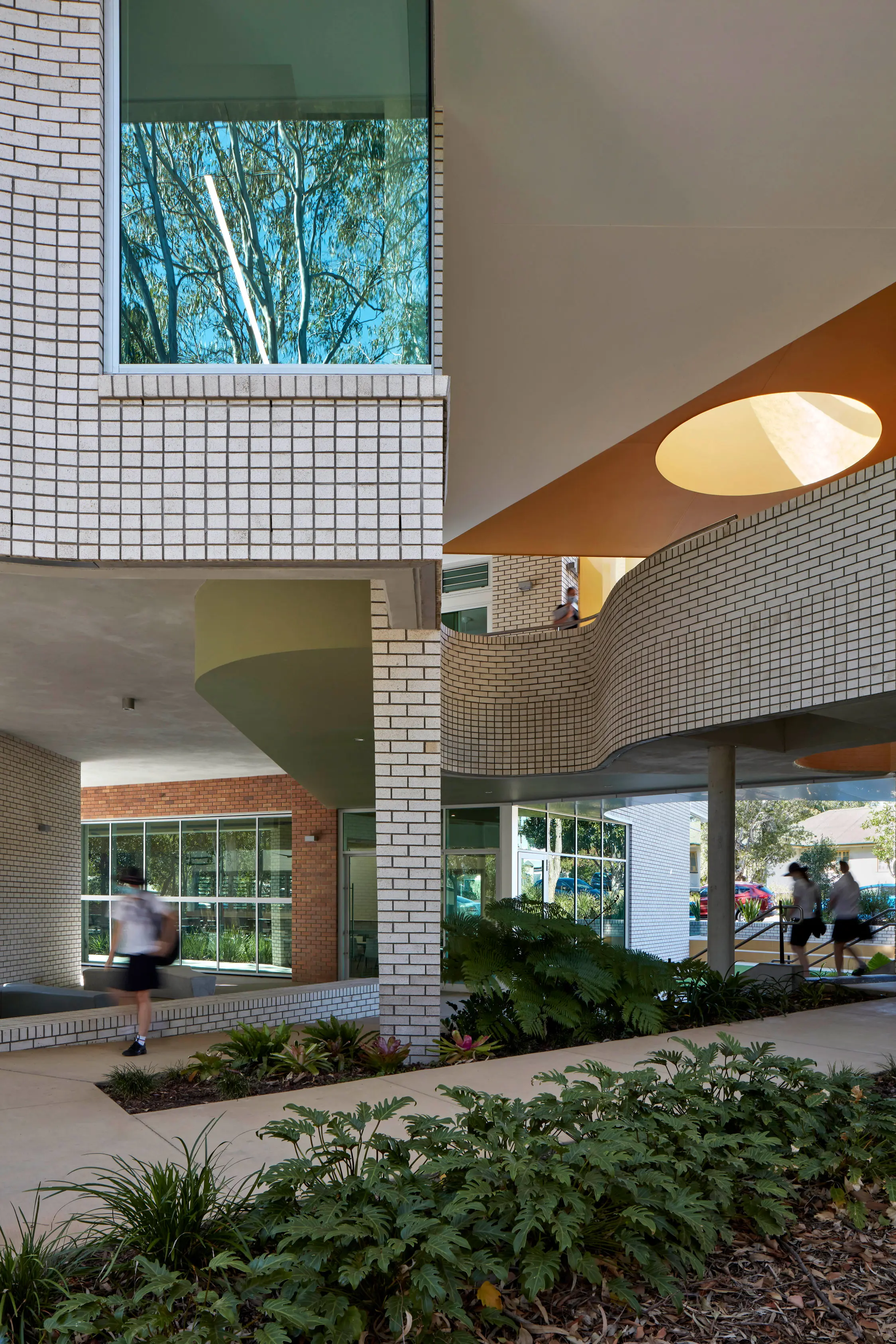 White brick exterior of school entryway