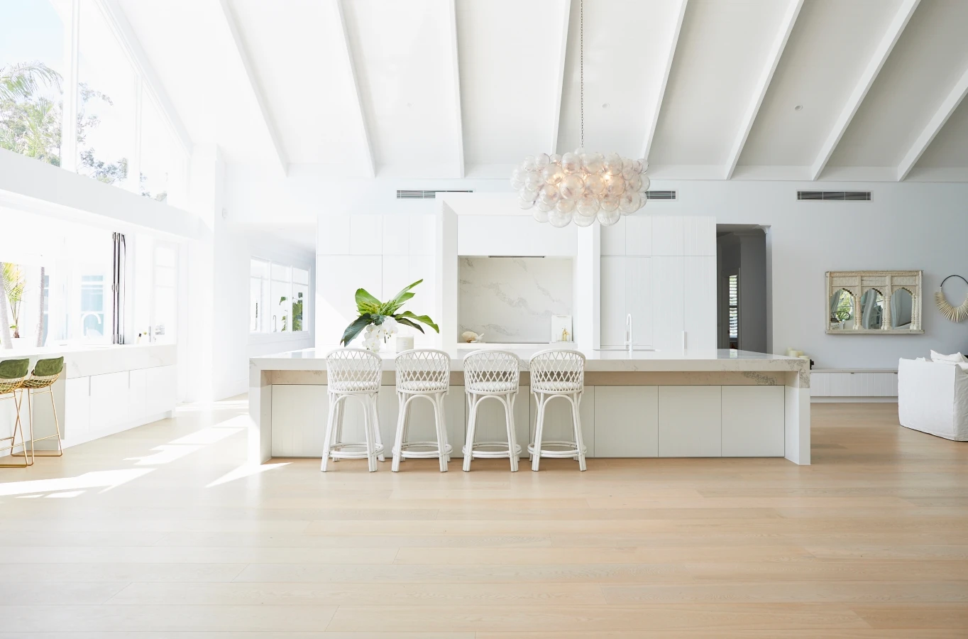 Kitchen with long island bench and high ceilings. Bonnie's Dream Home by Three Birds Renovations. Interior: Dulux White on White™