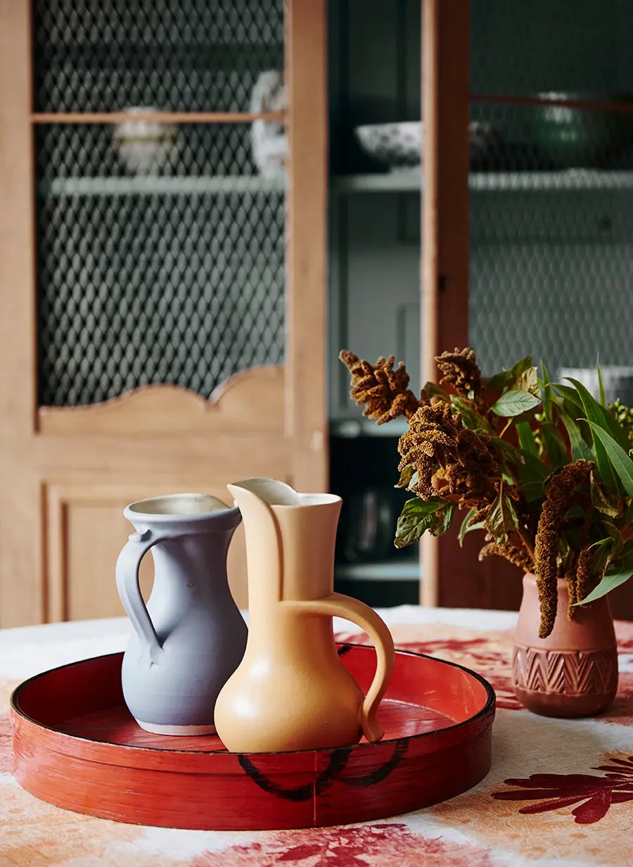 interior dinning close up on red tray and jugs. 