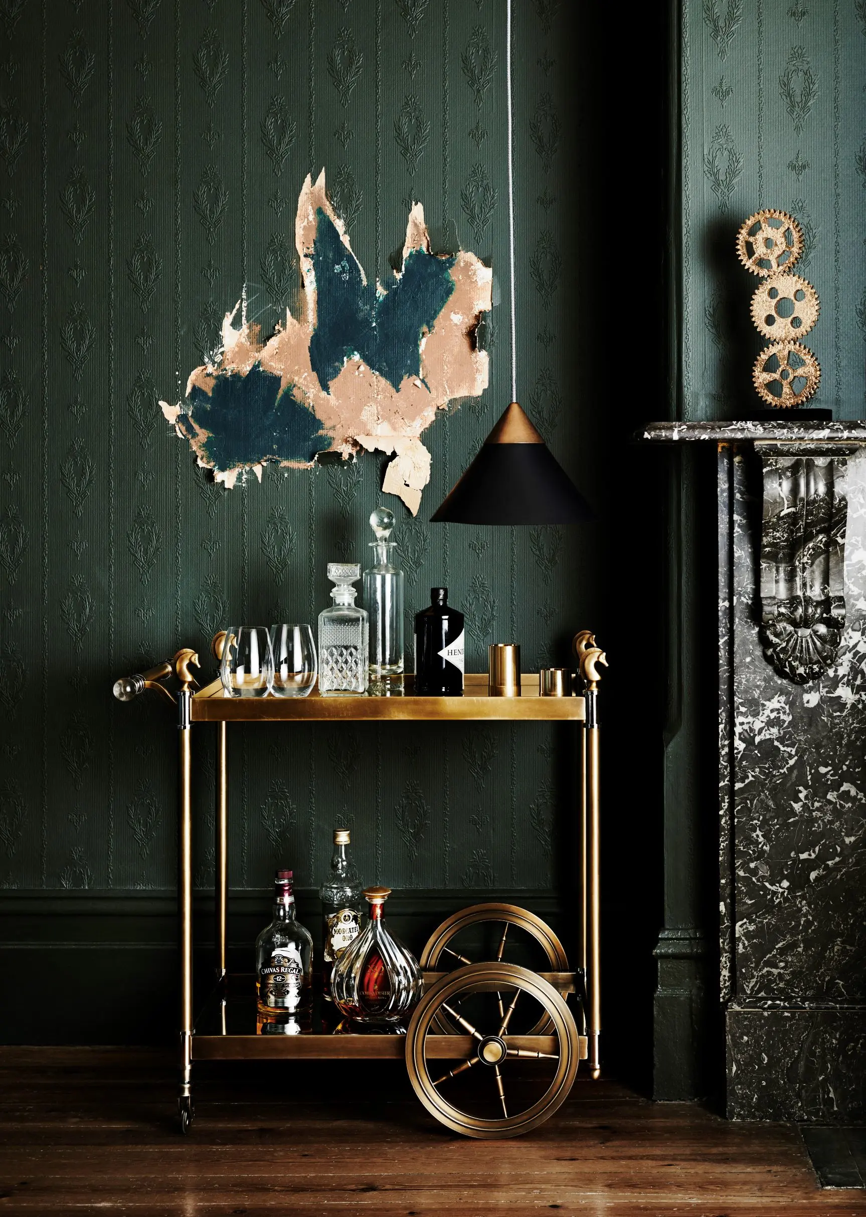 Green room, black mantle, gold bar cart.